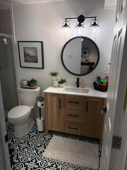 Bathroom with patterned floor tile and tiled shower